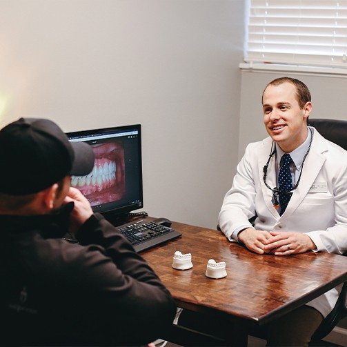 Dentist discussing porcelain veneers with patient