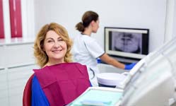 smiling woman sitting in the dental chair